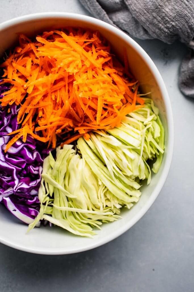 Ingredients for vinegar slaw in mixing bowl