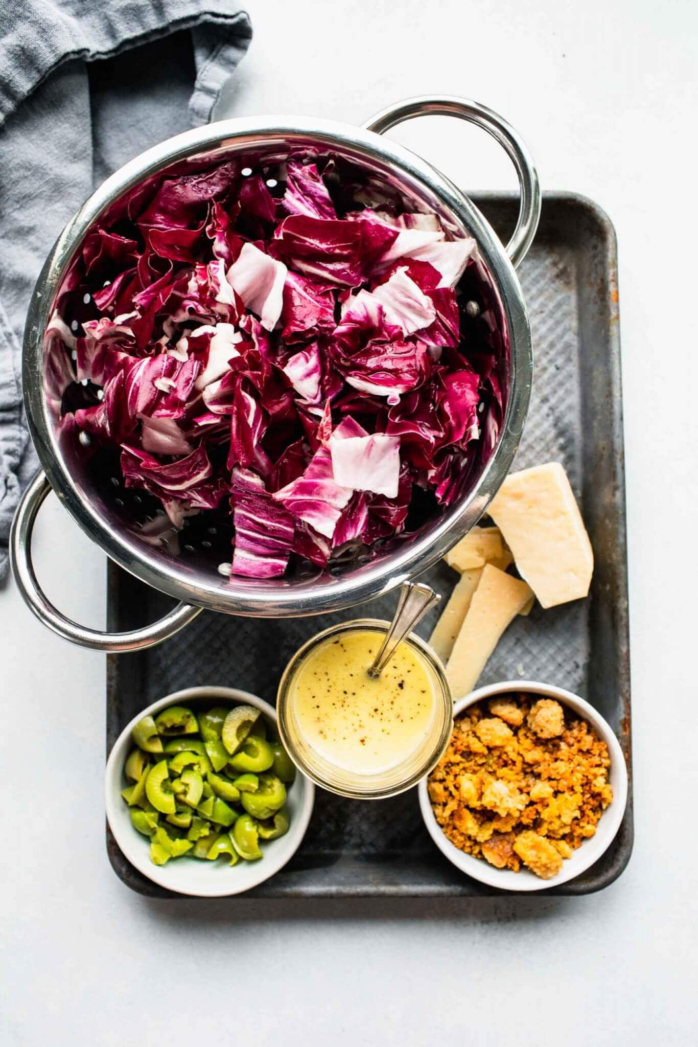 Ingredients for radicchio salad laid out on tray.
