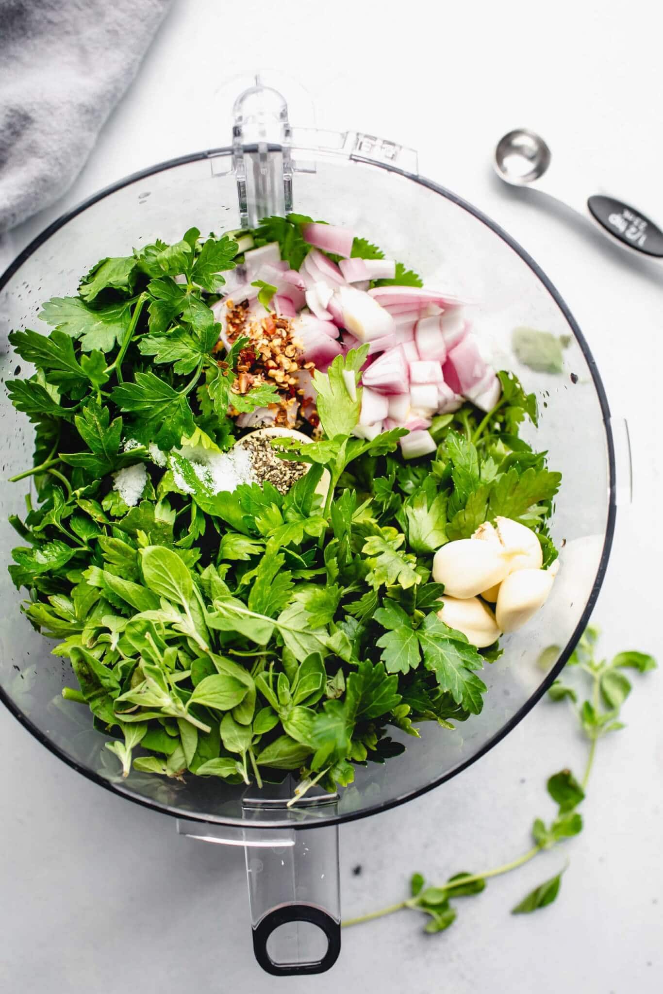 Ingredients for chimichurri sauce in food processor