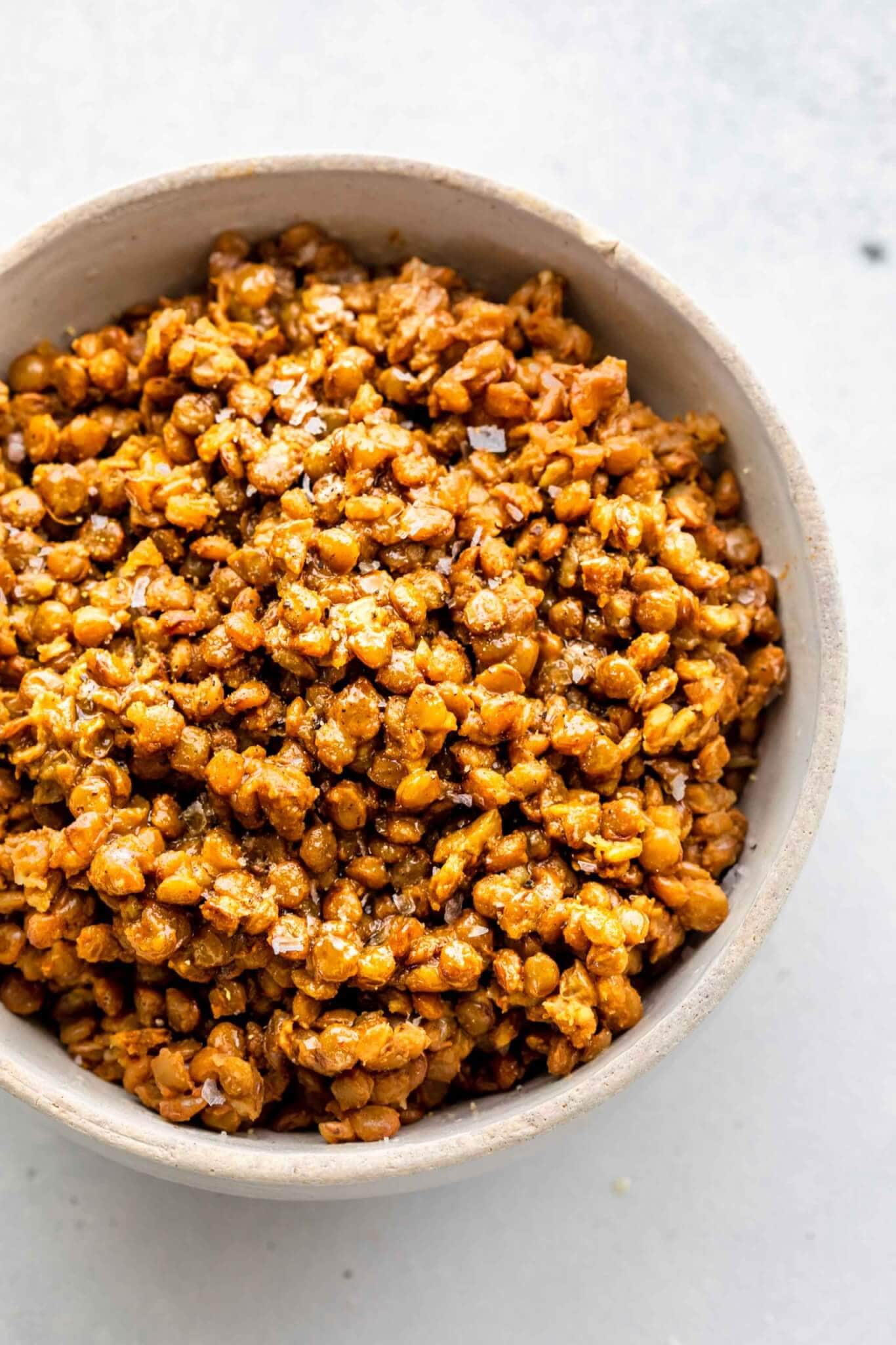 Cooked instant pot lentils in white bowl