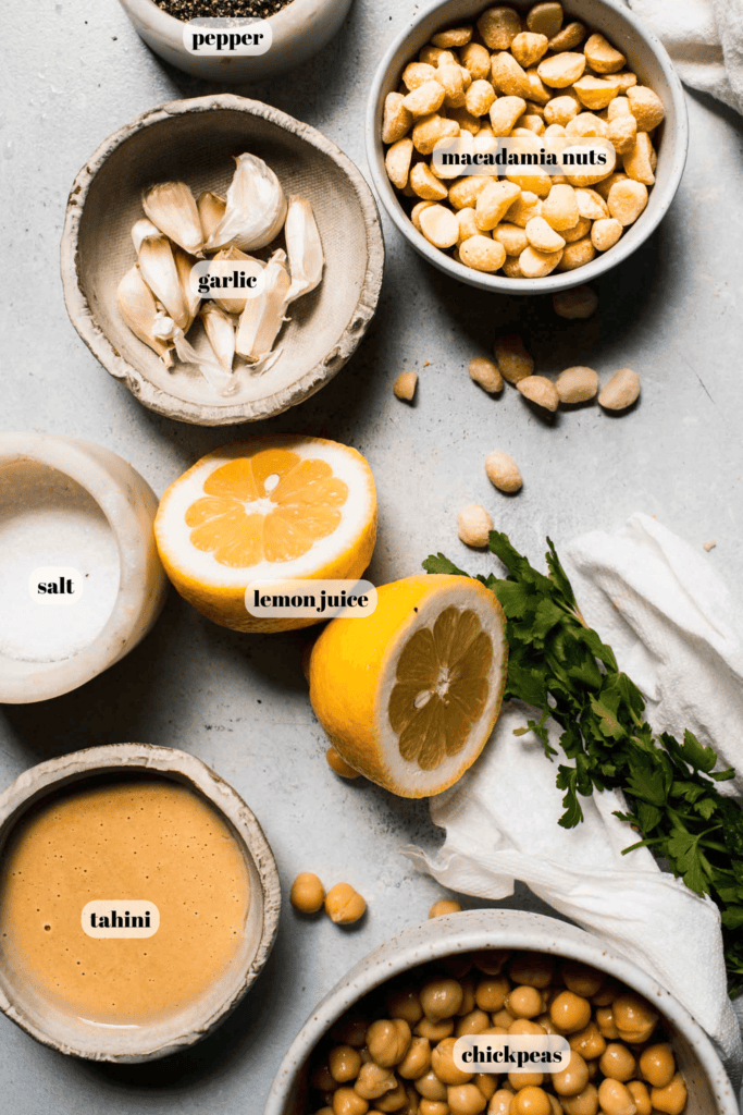 Ingredients for macadamia nut hummus labeled on counter. 