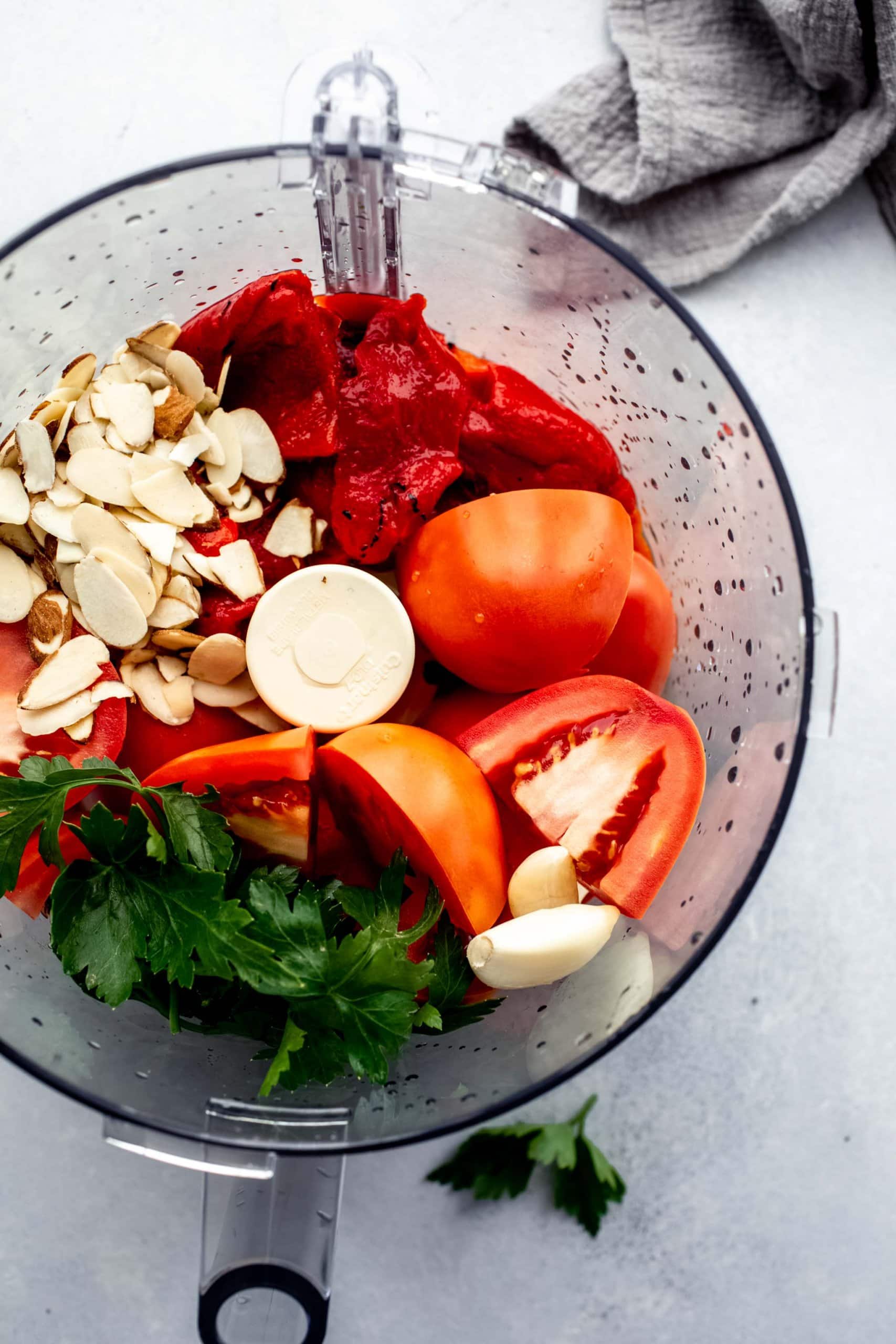 Ingredients for romesco sauce in food processor.