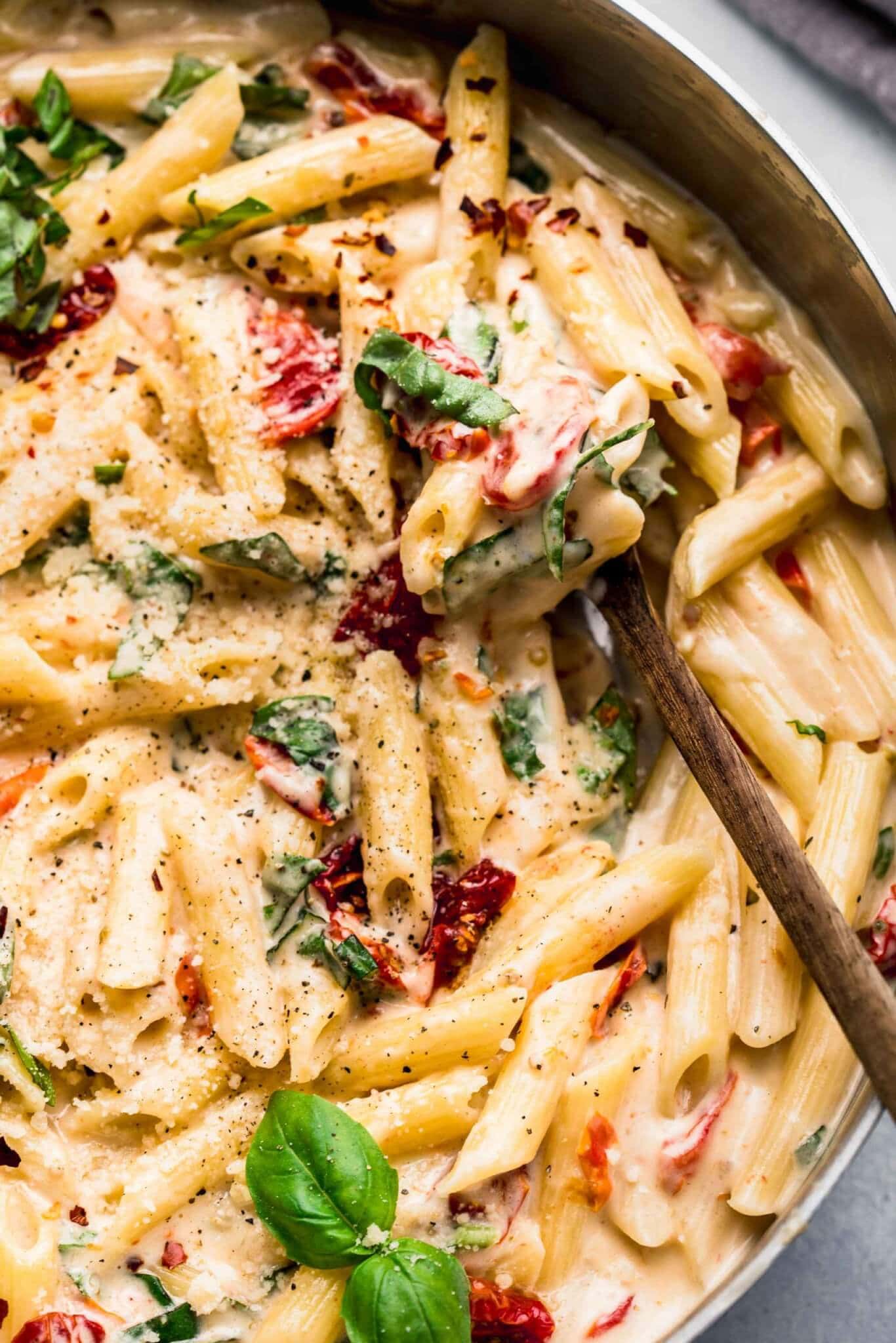 Sun dried tomato pasta in skillet ready to serve.