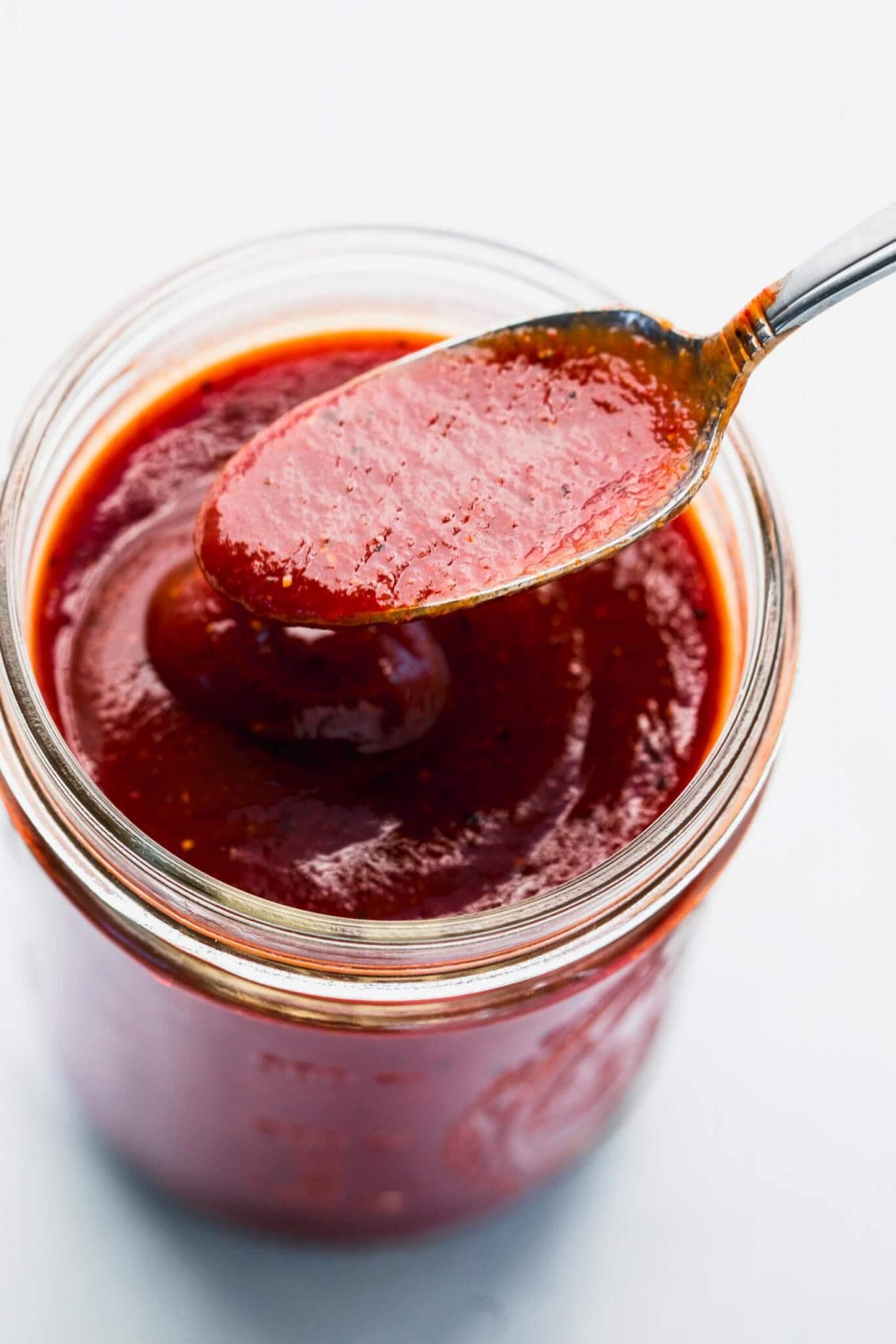 Overhead close up of spoon in bbq sauce