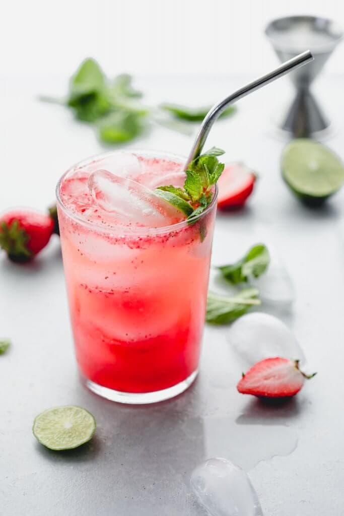 Easy strawberry mojito prepared on counter. 