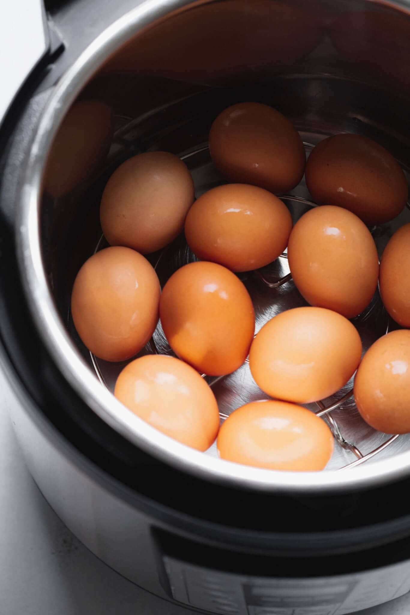 Eggs in the instant pot on a metal trivet.