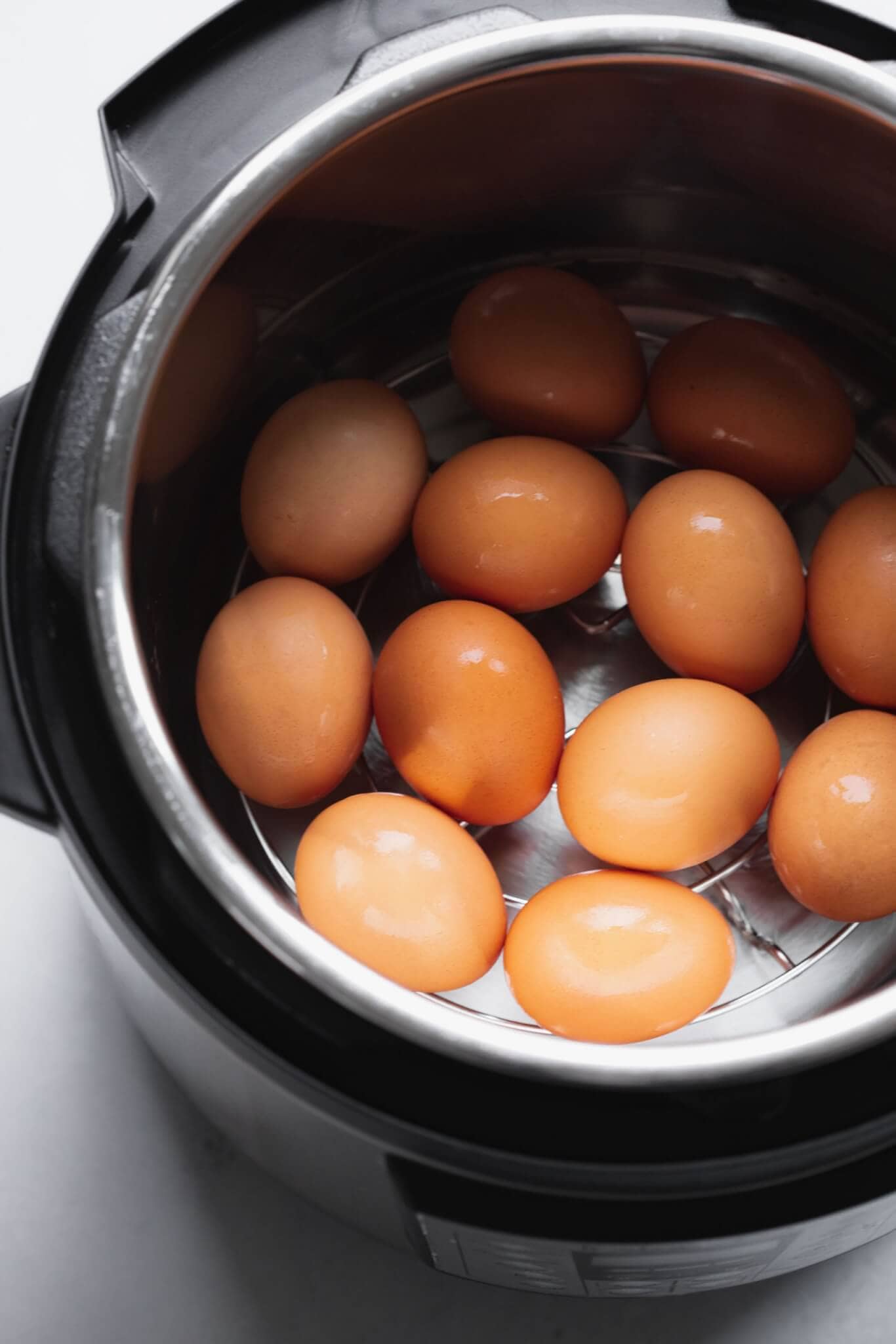 Eggs in the instant pot on a metal trivet.