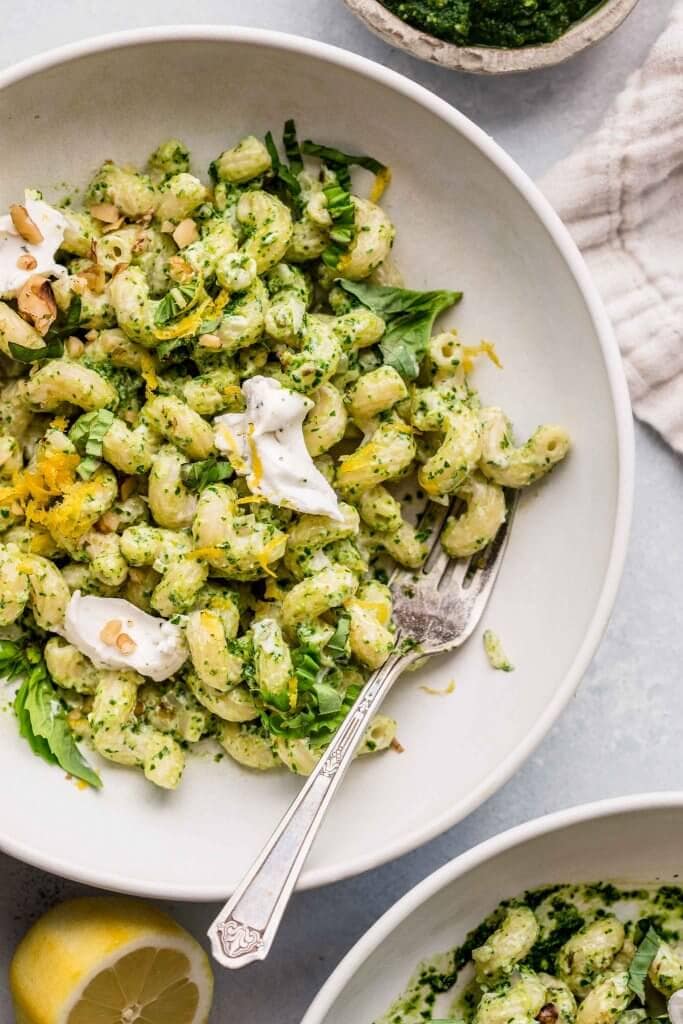 Overhead close up of pesto goat cheese pasta. 