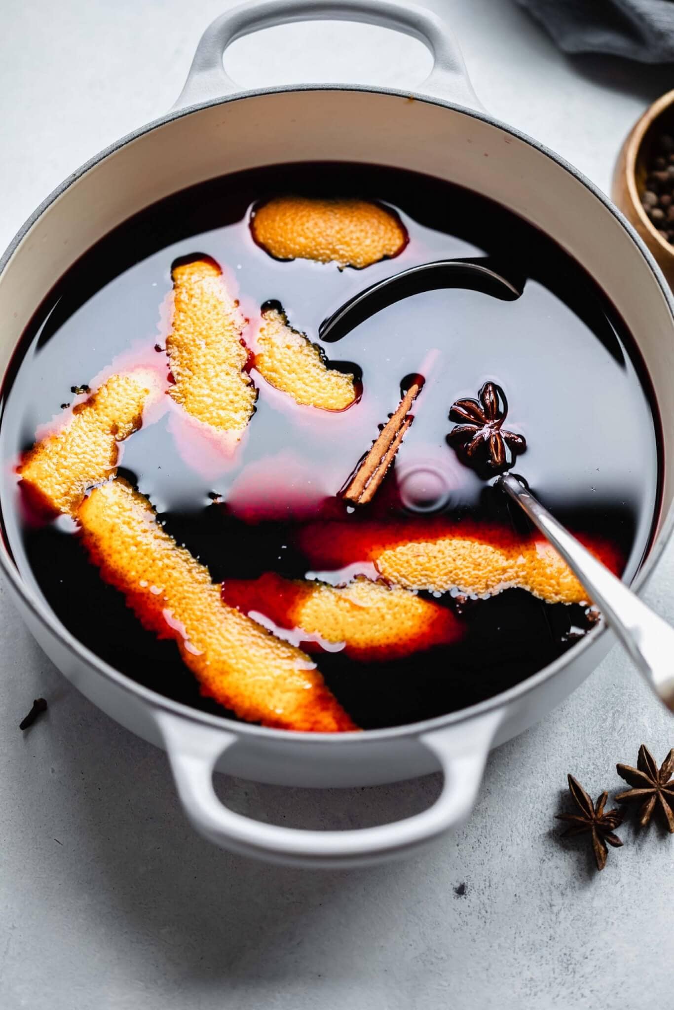 Mulled wine in large pot with ladle. 