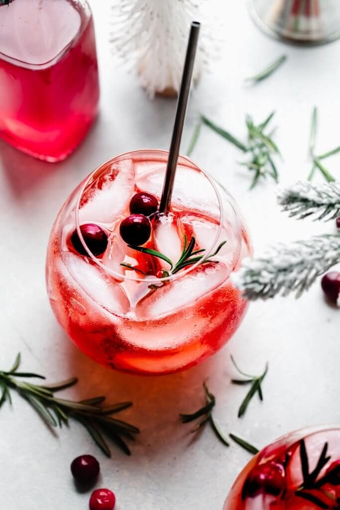 Overhead close up of glass of winter aperol spritz. 