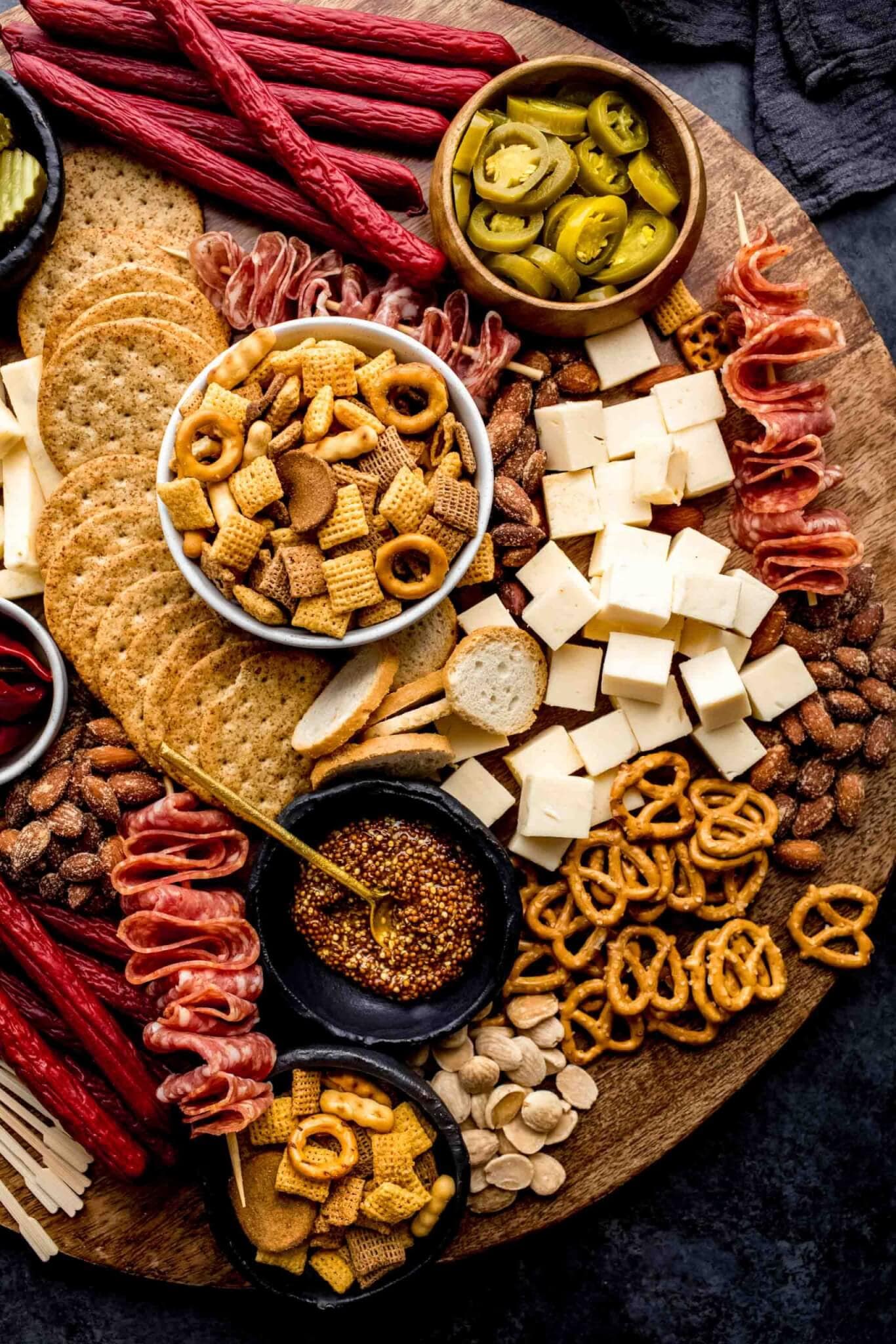 Game day charcuterie board on round wood tray. 