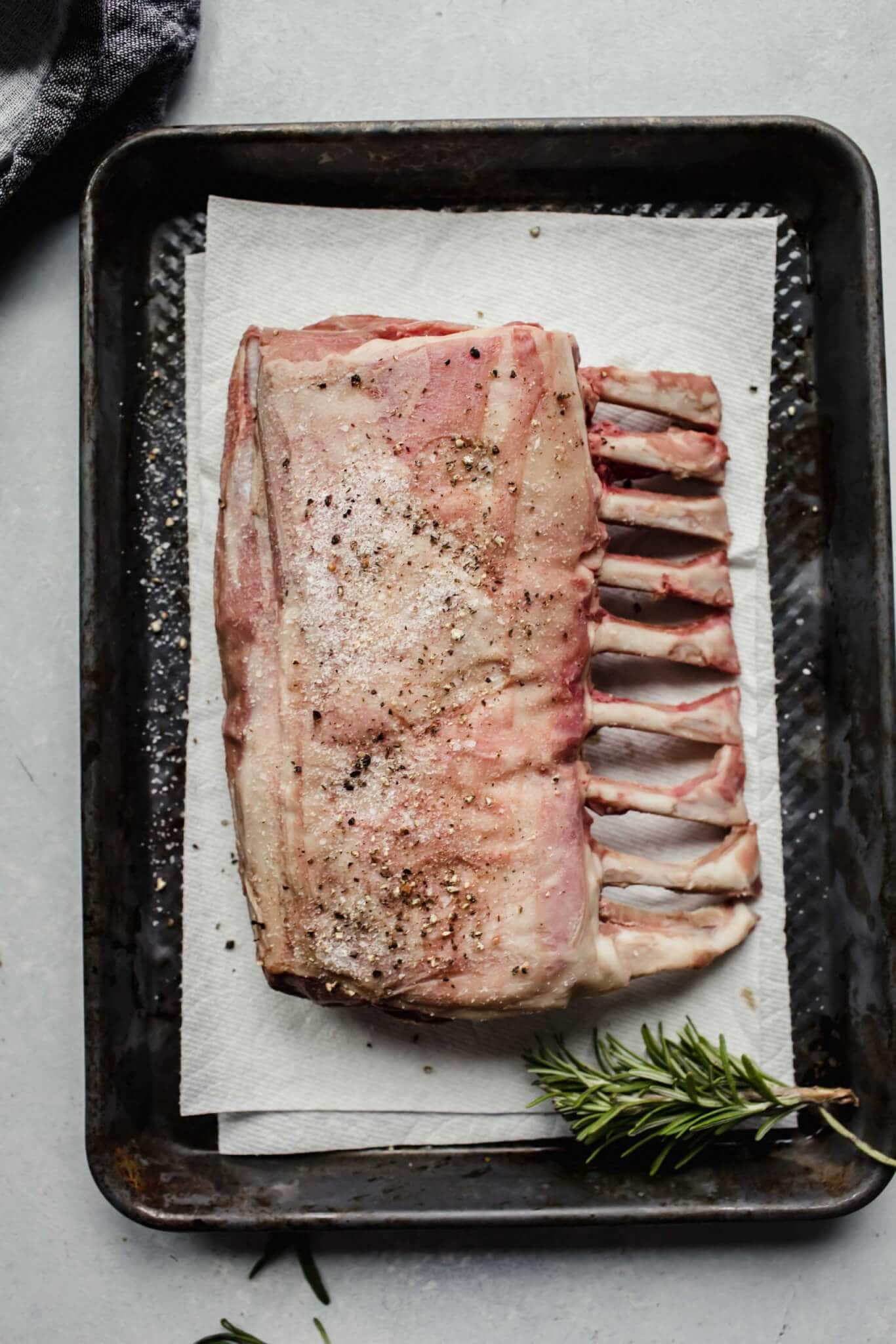 Lamb seasoned with salt and pepper.