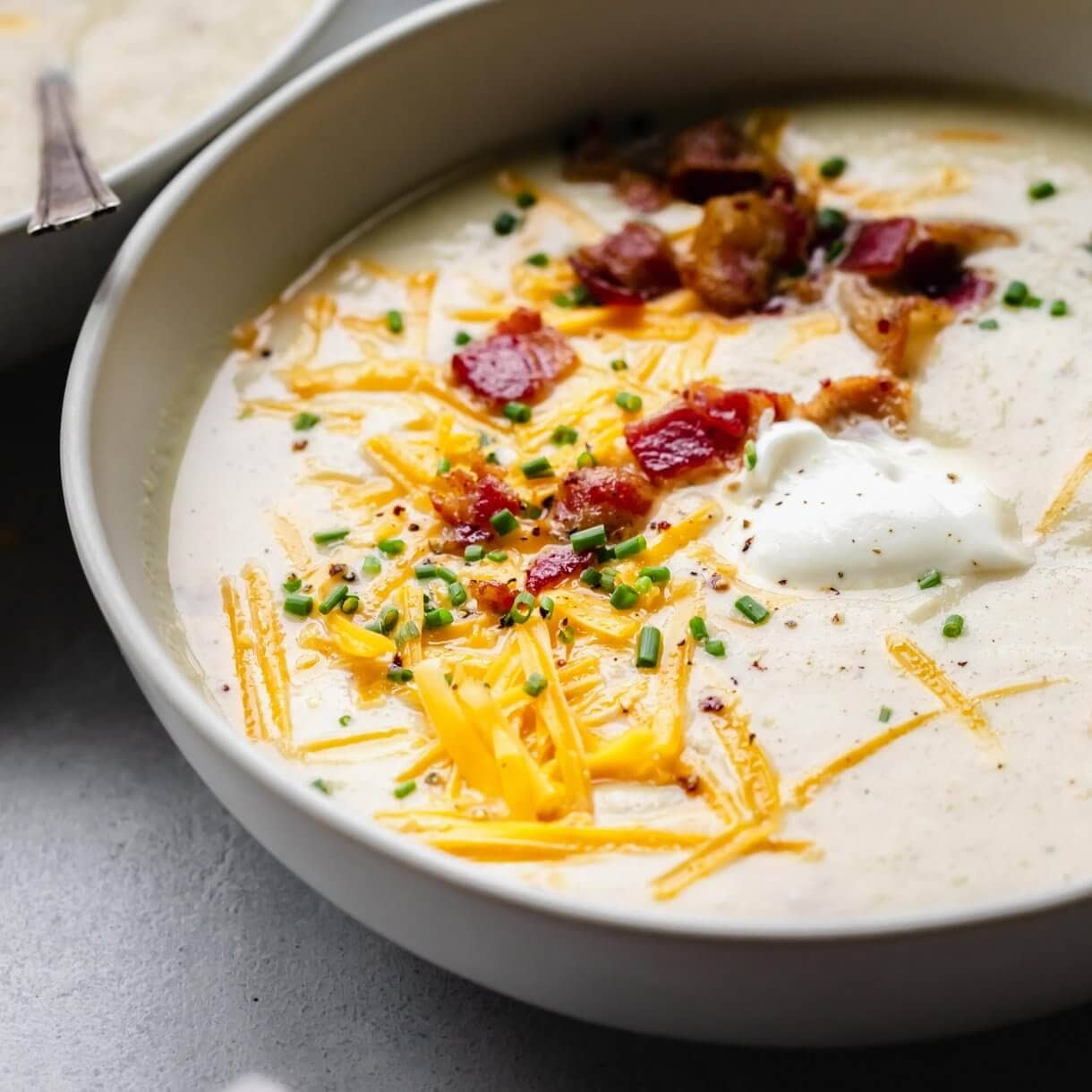 Slow Cooker Cauliflower Soup (Cheesy + Creamy)