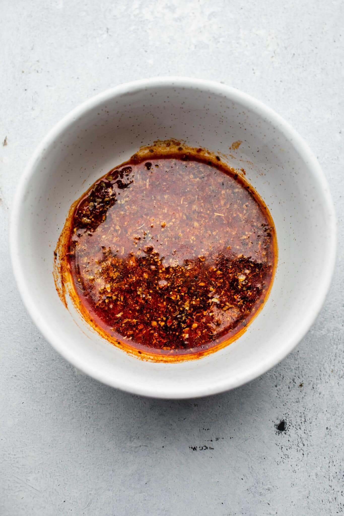 Spice mixture combined in bowl.