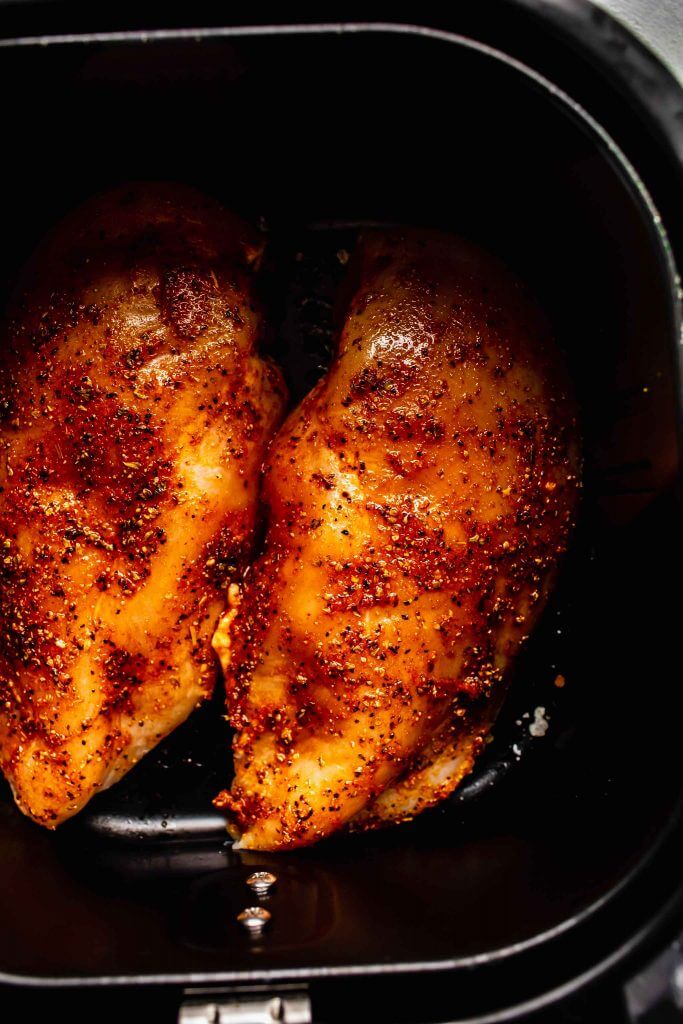 Spice mixture rubbed on raw breasts in air fryer