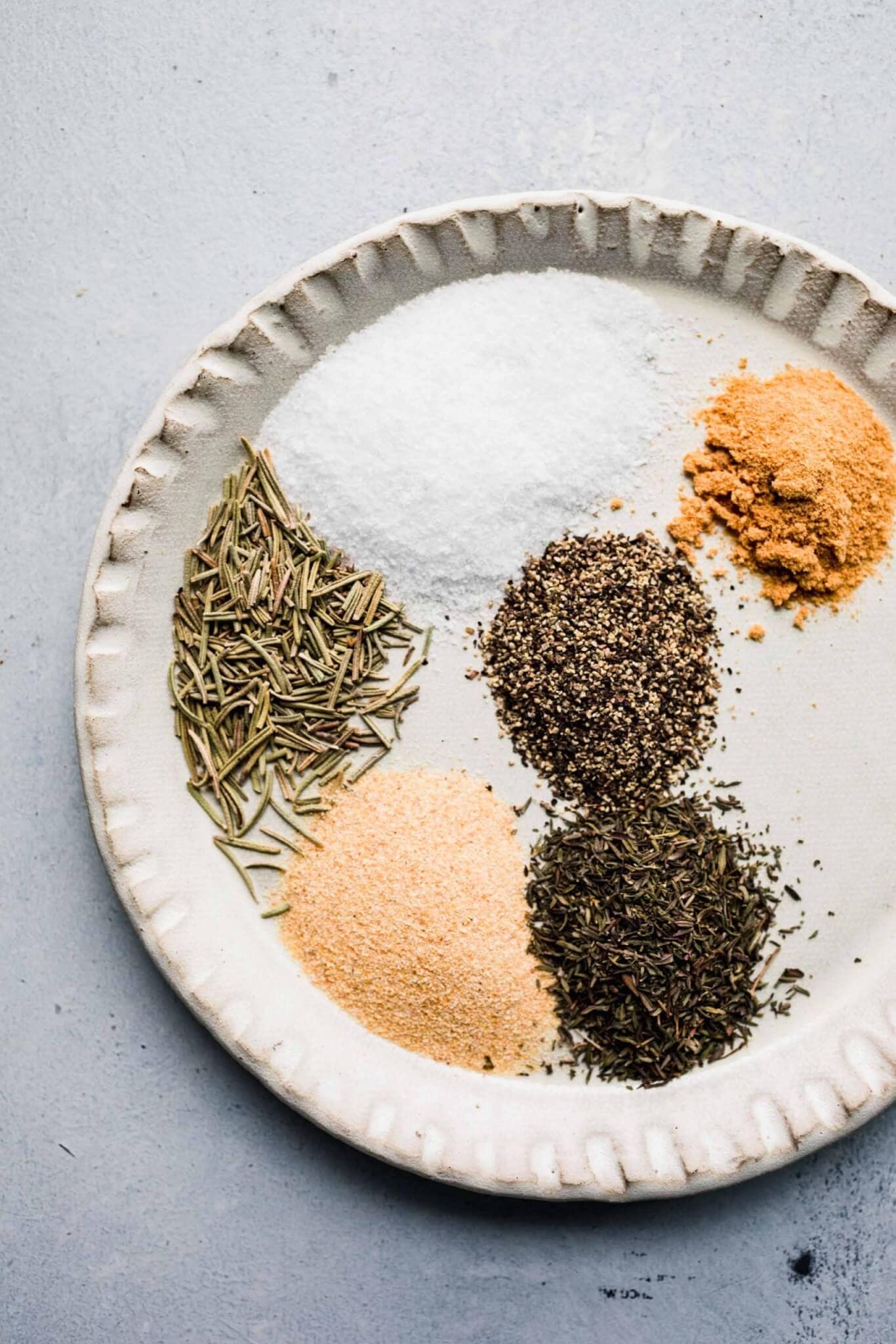 Seasonings for pot roast in white bowl