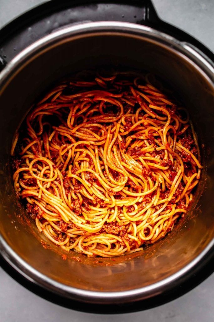top shot of spaghetti cooking in pressure cooker