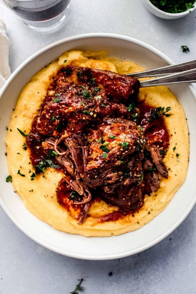 short ribs and mashed potatoes in white bowl