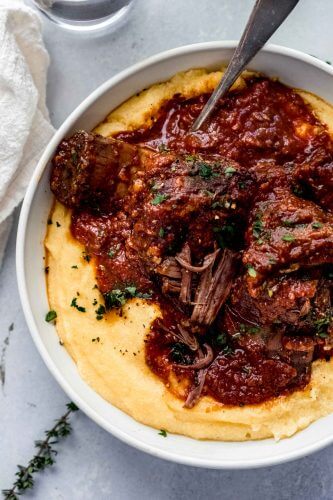 short ribs and mashed potatoes in white bowl