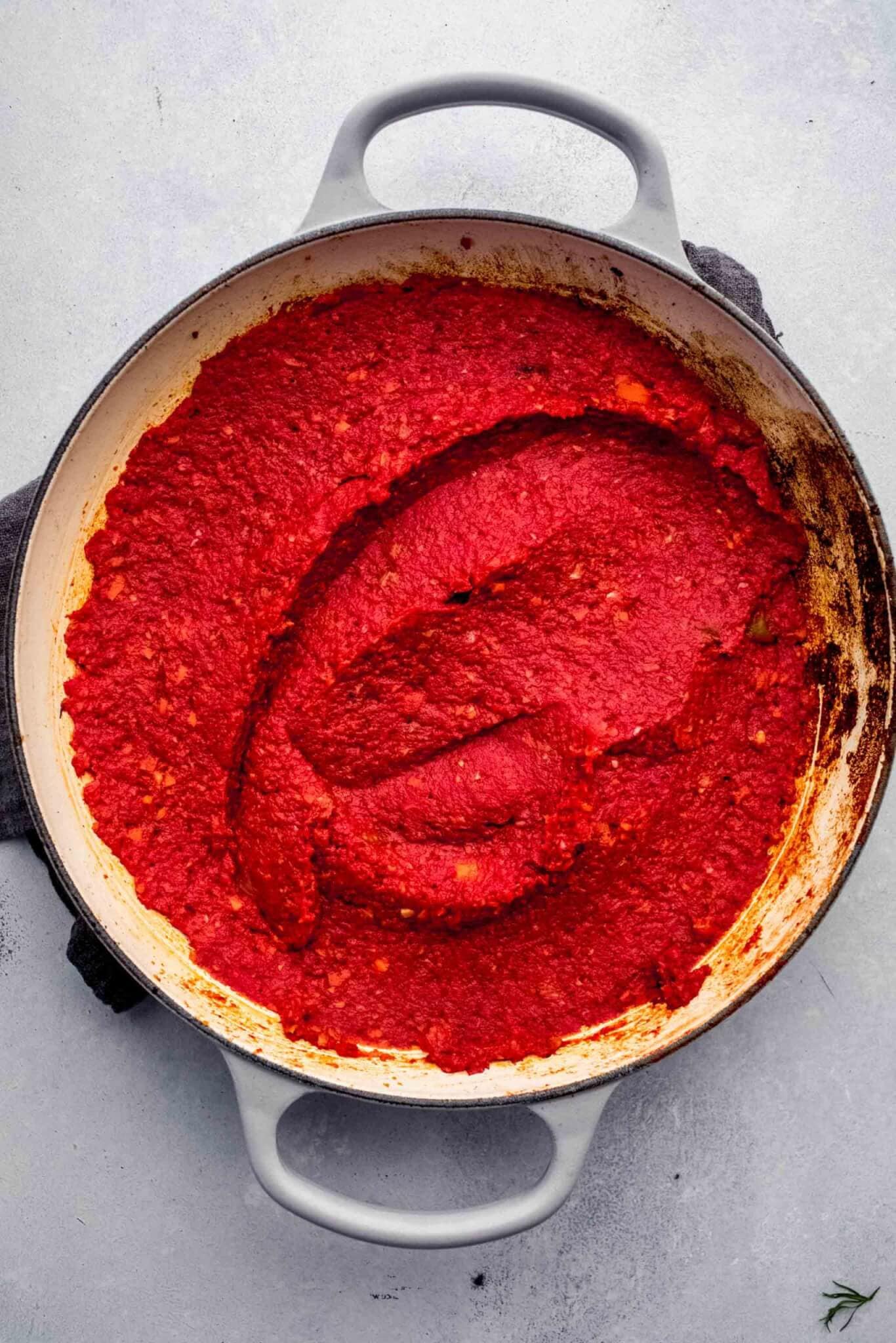 top shot of red sauce puree in dutch oven
