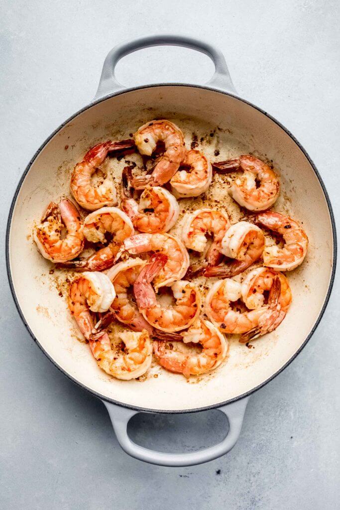 Sauteed shrimp in skillet. 