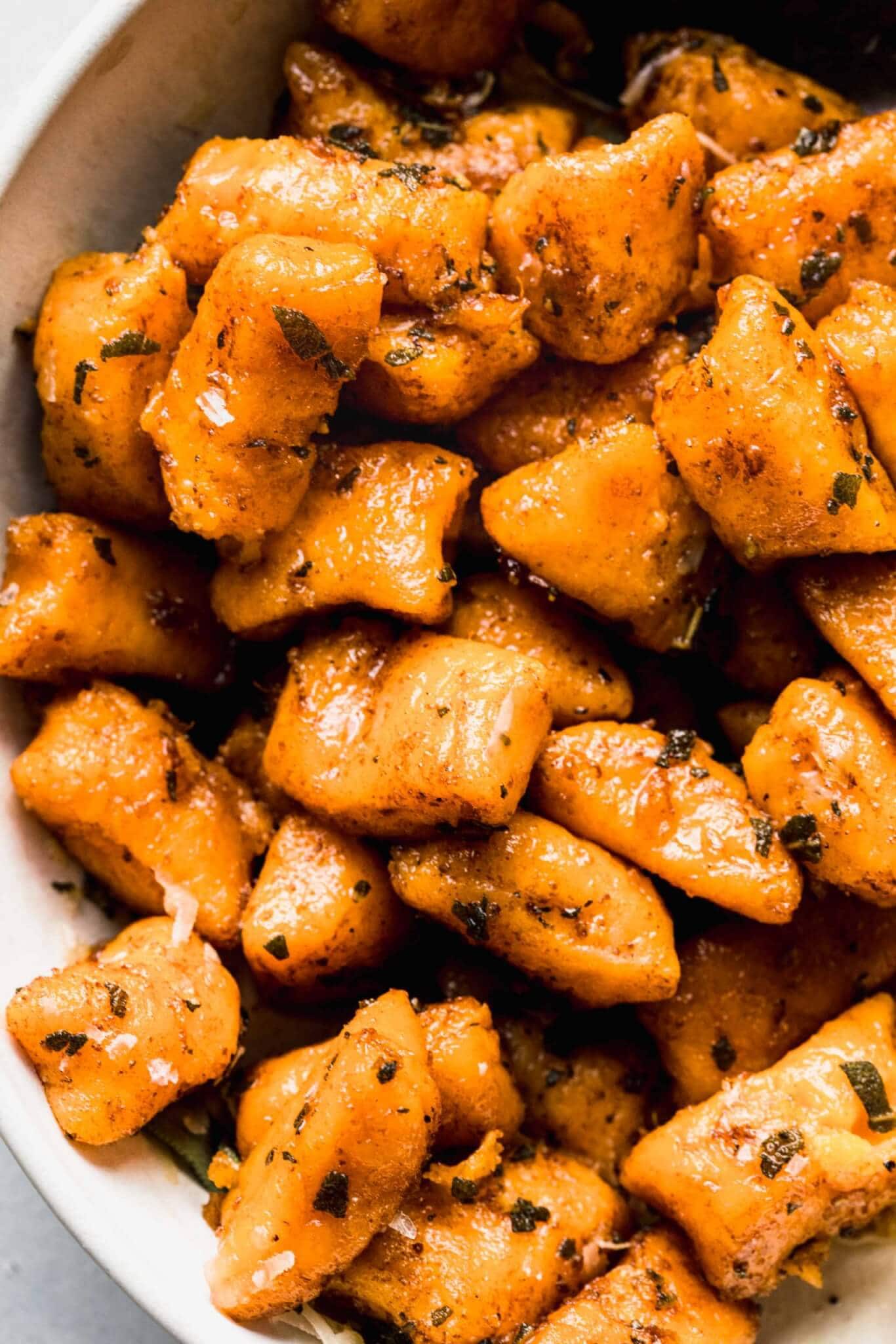 Close up of sweet potato gnocchi in bowl.