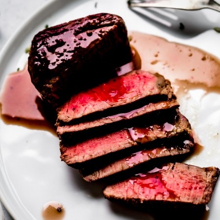 Bordelaise sauce drizzled on sliced filet mignon.