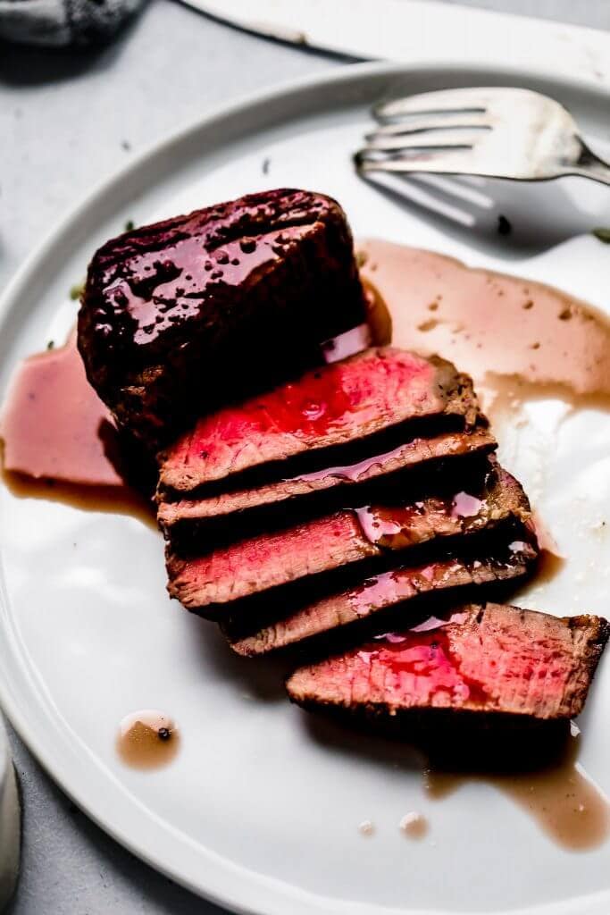 Bordelaise sauce drizzled on sliced filet mignon.