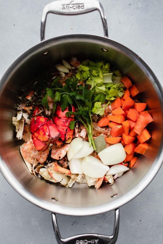 Seafood stock ingredients in pot. 