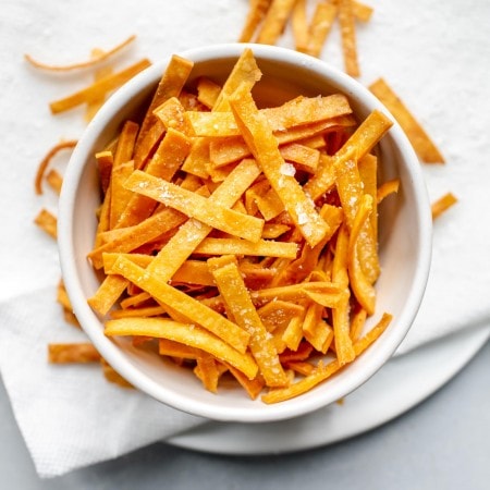 Overhead shot of tortilla strips in bowl.