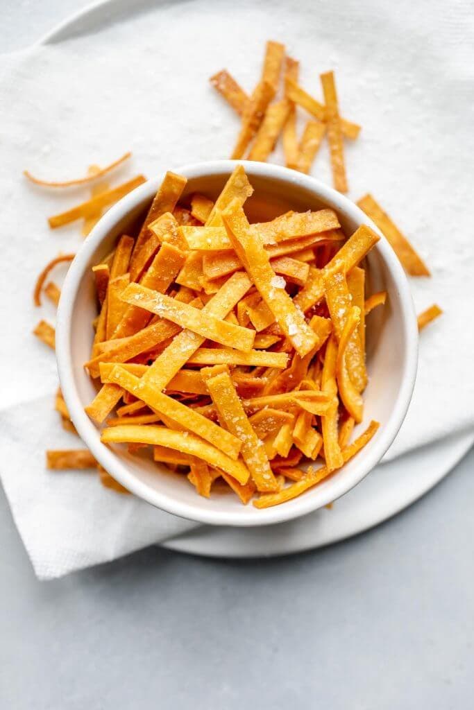 Overhead shot of tortilla strips in bowl.