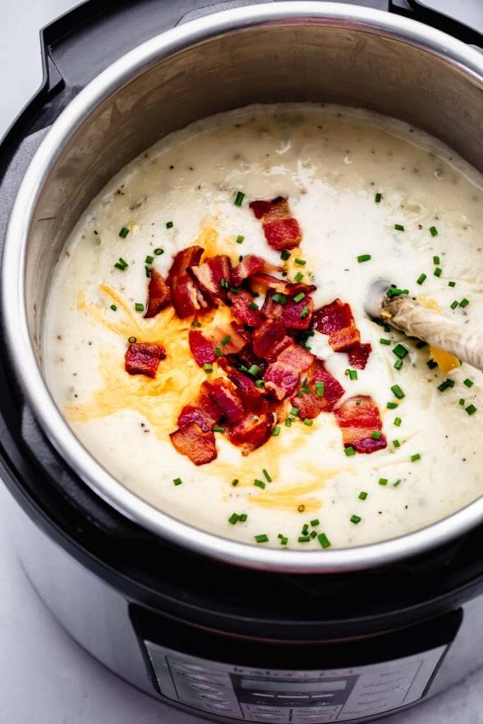 Soup in instant pot topped with bacon crumbles.