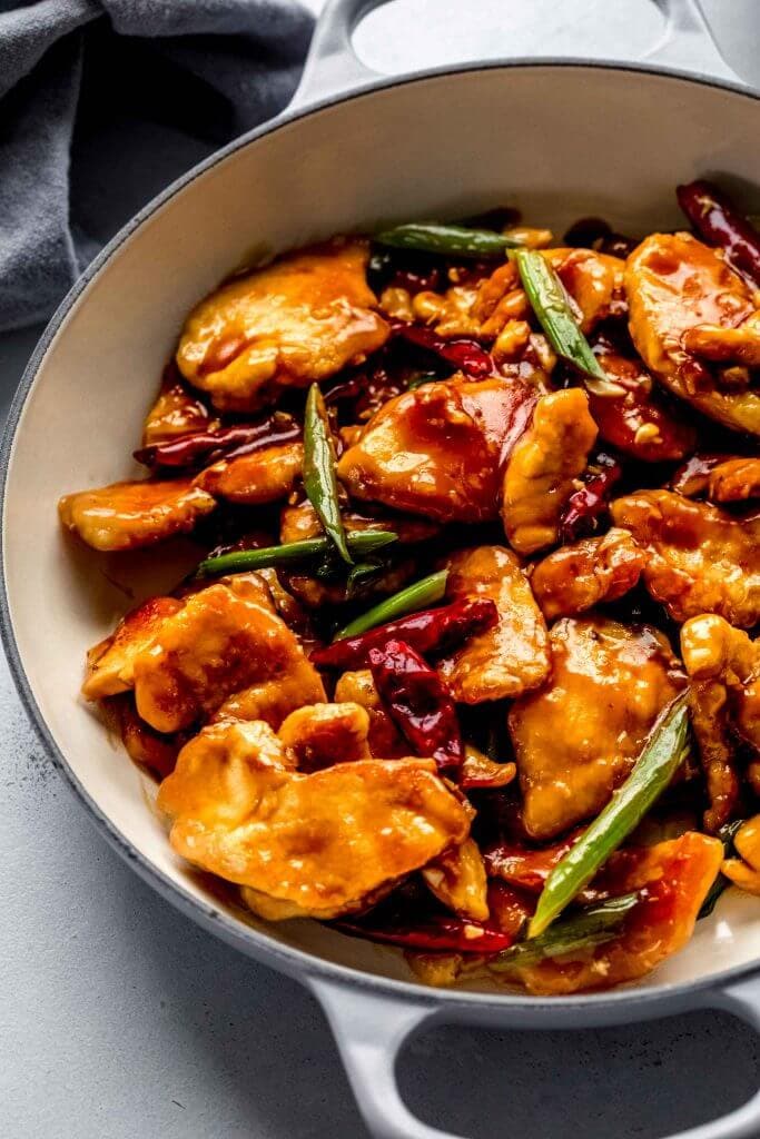Side view of mongolian chicken in skillet.