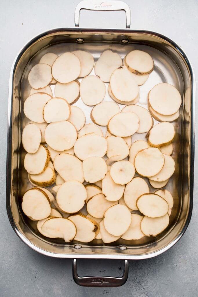 Potato slices soaking in water.