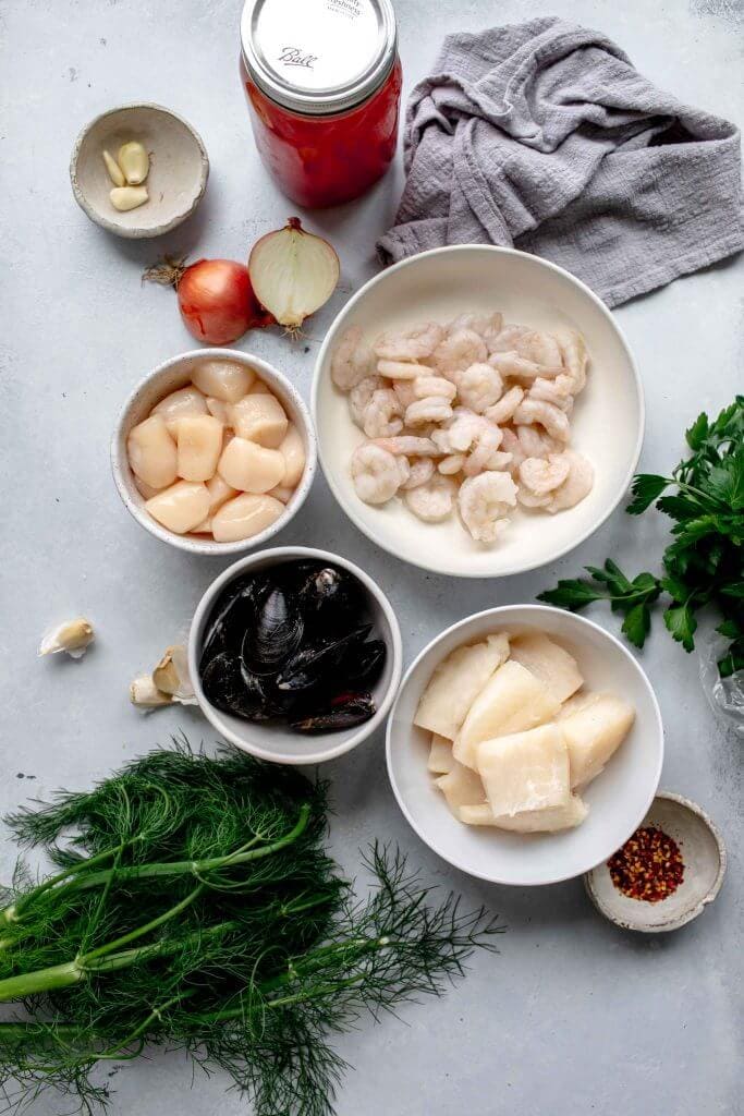 Ingredients for cioppino on counter. 