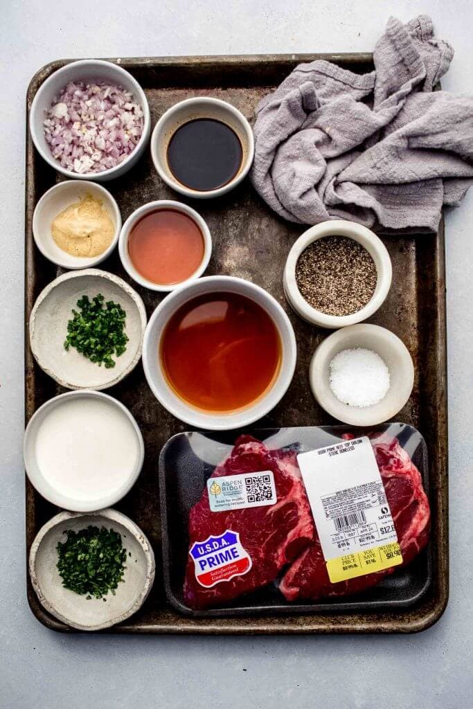 Ingredients for steak diane on tray. 