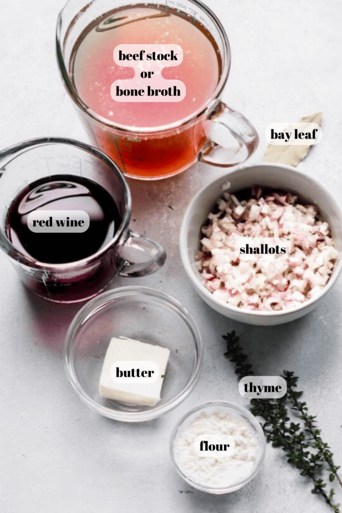 Ingredients for bordelaise sauce labeled on counter.