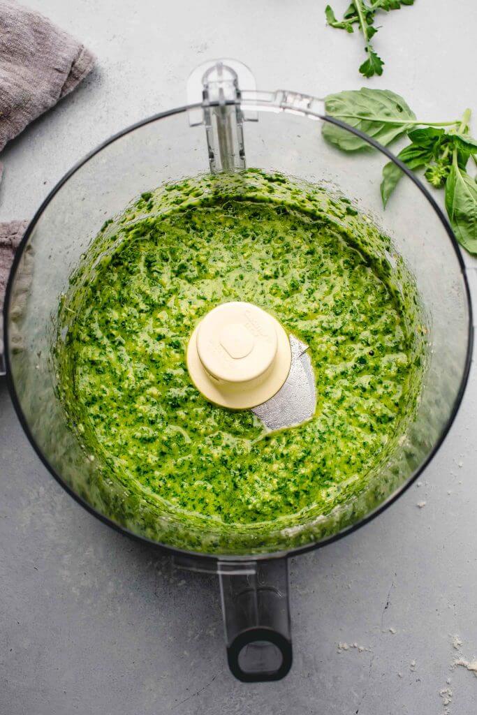 Arugula pesto blended in food processor. 