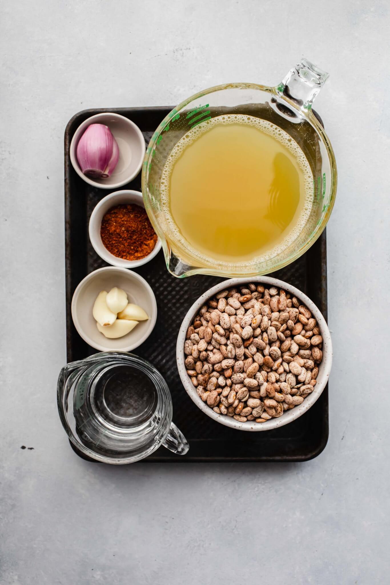 Ingredients for instant pot pinto beans on small tray.