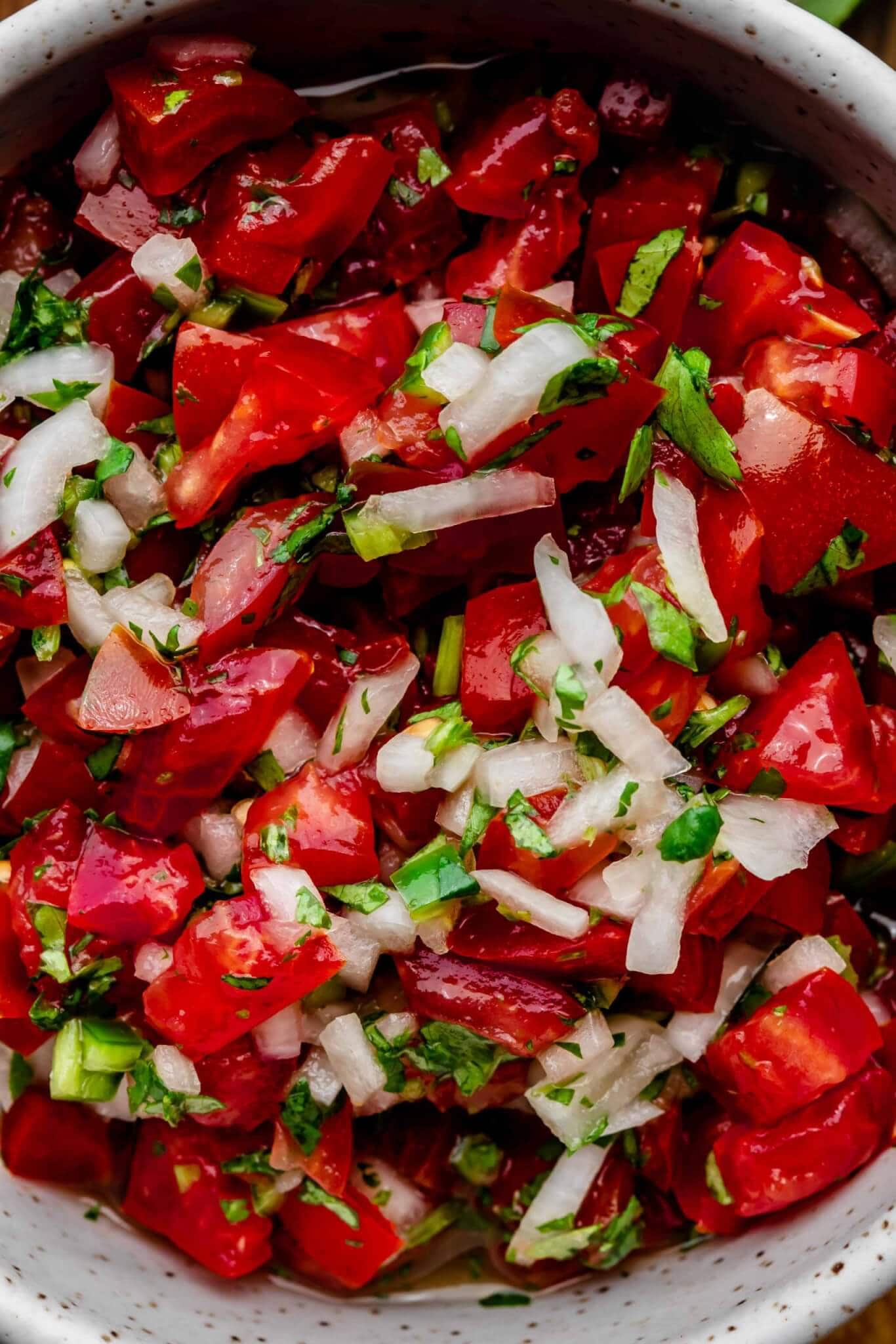 Overhead closeup of pico de gallo in bowl.