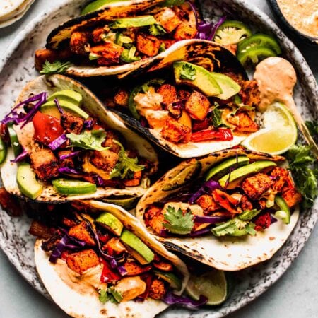 Sweet potato tacos arranged on plate.