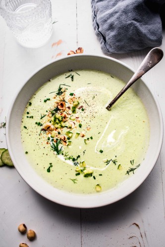 Overhead shot of bowl of cold cucumber soup.