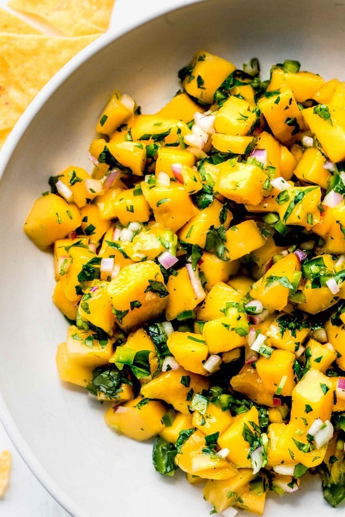 Overhead close up of bowl of mango salsa. 