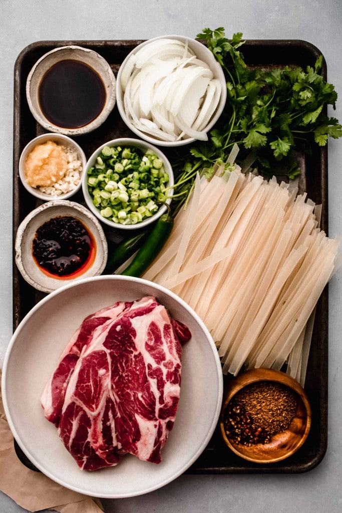 Ingredients for cumin lamb noodles on tray.