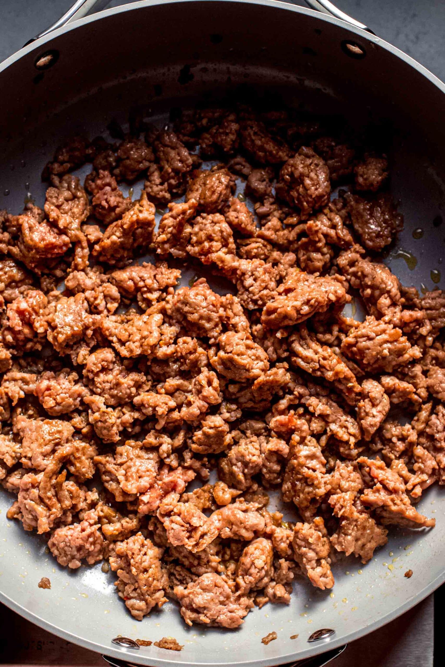 Browned sausage in skillet.