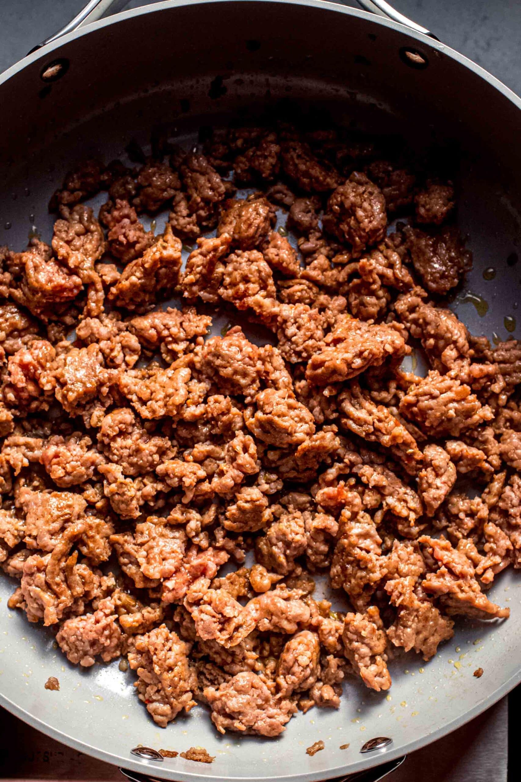 Browned sausage in skillet. 