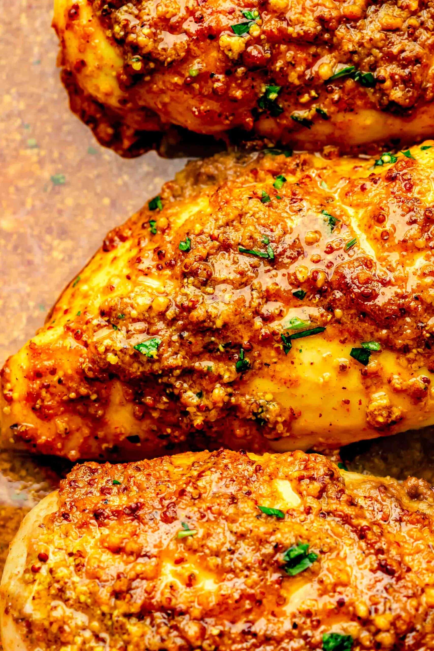 Curried chicken breasts in baking dish.