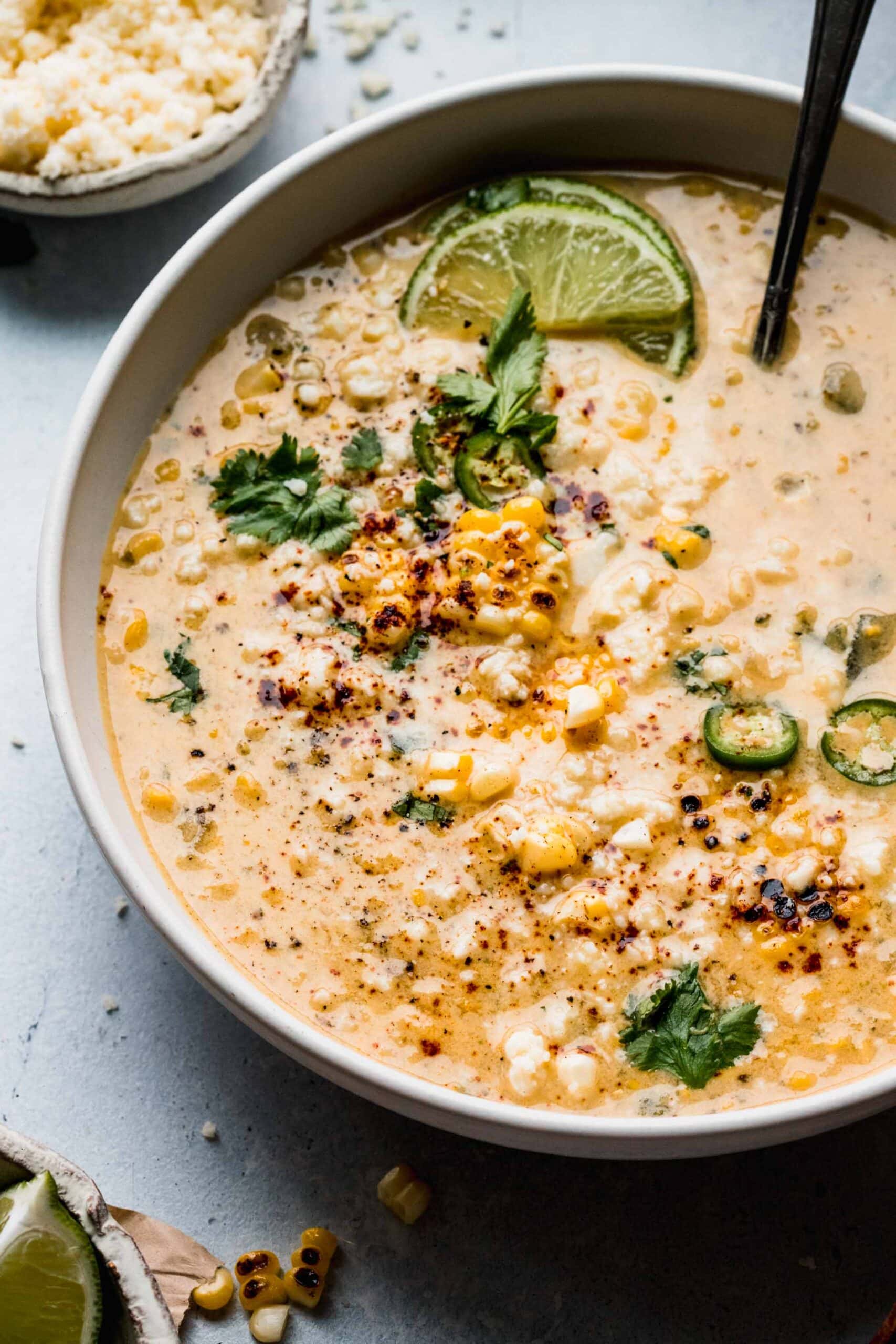 Side view of mexican corn soup in bowl.