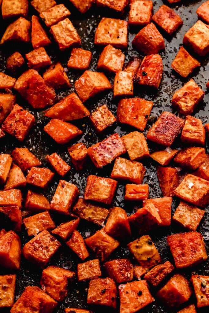 roasted sweet potatoes on baking tray. 