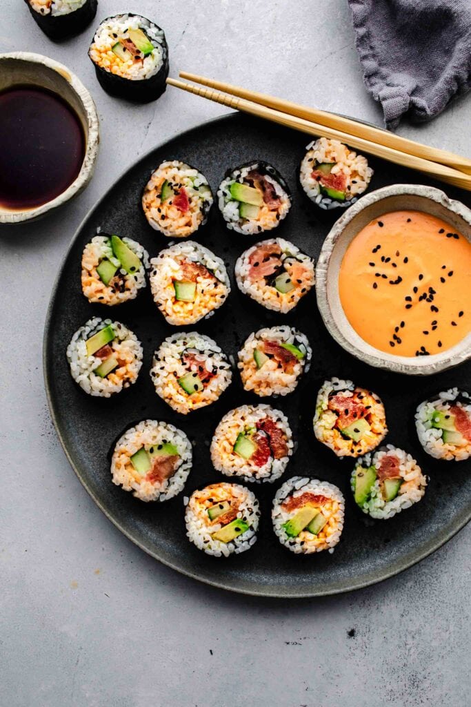 Vegetarian sushi arranged on grey plate. 